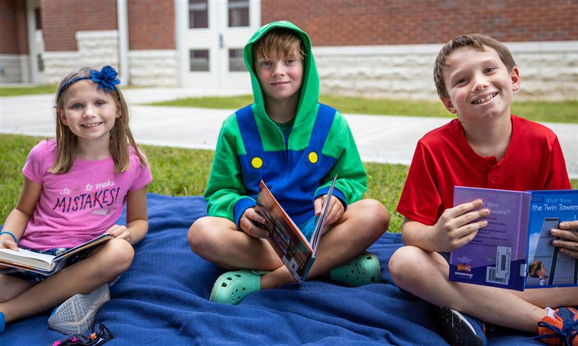 Students read books outside